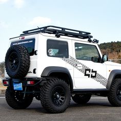 a white jeep parked in a parking lot