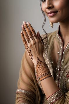 a woman with henna on her hands