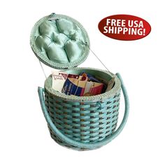 the basket is filled with books and has a cushion in it for storage on top