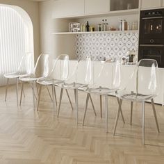 there are many chairs lined up in the kitchen