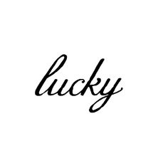 the word lucky written in cursive writing on a white background with black ink