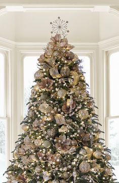 a decorated christmas tree in a living room