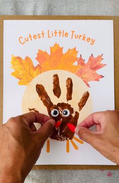 a person is making a turkey craft with their hands