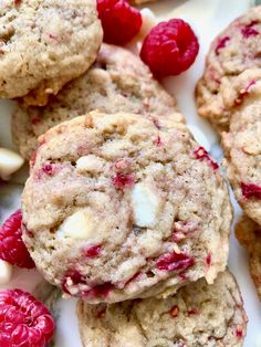 raspberry white chocolate chip cookies are piled on top of each other and ready to be eaten