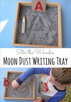 a young boy is playing with sand in his letter tray and writing letters on it