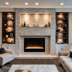 a living room filled with furniture and a fire place in front of a stone fireplace