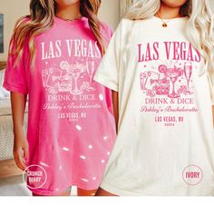 two women wearing las vegas t - shirts