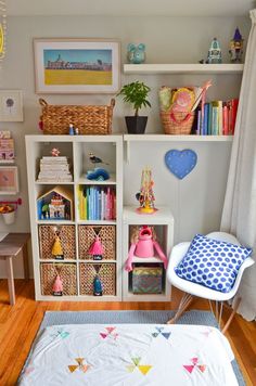 a child's room with toys and bookshelves