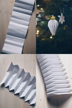 paper ornaments are arranged on top of a wooden table