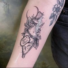 a woman's arm with a tattoo on it