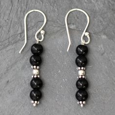 Narayani designs stylish earrings to showcase the sleek allure of black onyx. Crafted by hand they combine polished gemstone globes with ornate silver beads. .925 Sterling silver Simple Beaded Earrings, Black Bead Earrings, Fork Jewelry, Silver Jewelry Box, Onyx Necklace, Stylish Necklace, Onyx Earrings