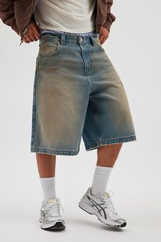 Oversized BDG baggy jorts in premium BDG denim. Longline denim shorts with a relaxed fit and zip fly. Urban Outfitters exclusive. Features BDG Astro baggy washed denim jorts Longline denim shorts Mid rise waist Rigid BDG denim Loose longline fit 5-pocket; zip fly UO exclusive Content + Care 100% Cotton Machine wash Imported Size + Fit Model in Dark Green 6'1.5" and wearing size 32 Measurements taken from size 32 Rise: 14" Inseam: 11.5" Leg opening: 12.5" | BDG Astro Baggy Washed Denim Jort in Li Medium Wash Short Leg Bottoms For Streetwear, Baggy Wide Leg Shorts For Streetwear, Casual Wide Leg Jean Shorts For Streetwear, Urban Relaxed Fit Jean Shorts For Streetwear, Casual Medium Wash Shorts For Streetwear, Short Length Jean Shorts With Pockets For Streetwear, Blue Jean Shorts For Streetwear, Medium Wash Short Bottoms For Streetwear, Jean Shorts With Pockets For Streetwear