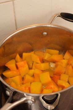 a person is stirring some food in a pot