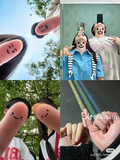 two people with faces drawn on their fingers and one holding a cell phone in the other's hand