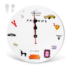 a white clock with various stickers on it