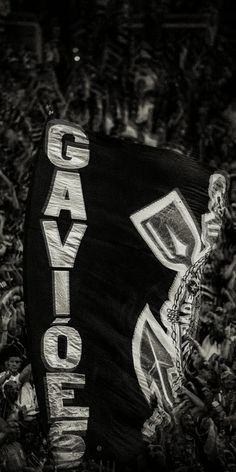 a black and white photo of a sign that says cayeque on it in the grass