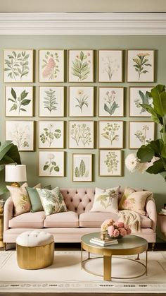 a living room filled with furniture and pictures on the wall above it's coffee table