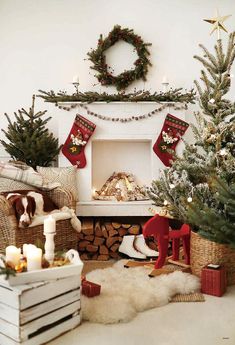 a living room decorated for christmas with stockings and decorations on the fireplace mantels