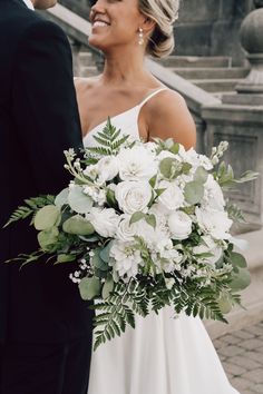 The perfect bouquet for your classic wedding. This bouquet is full of white stems such as football mums, roses, snapdragons and baby's breath and perfectly complimented by gern and silver dollar eucalyptus!

- Frame 805 Photography Greenery And White Bridal Bouquet, Mums And Roses Bouquet, Bridal Bouquet Different From Bridesmaids, Wedding Florals Greenery And White, Eucalyptus Bridal Bouquet White Flowers, Off White Wedding Bouquet, Wedding Bouquets Traditional, Wedding Day Flowers Bouquets, Wedding Flower White And Green