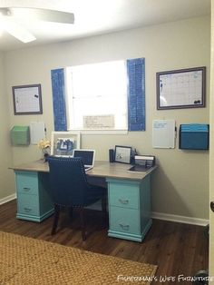 a home office with desk, chair and computer on the desk in front of a window