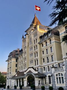 a large building with a flag on top of it