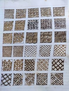 a bunch of different patterns on a piece of paper that has been drawn with pen