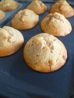 freshly baked muffins sitting on top of a blue tray