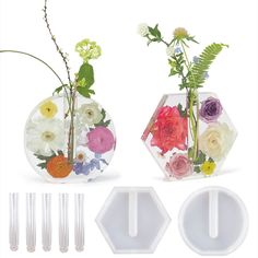 three vases with flowers in them sitting next to each other on a white background