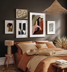 a bedroom with brown walls and pictures on the wall