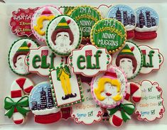 decorated cookies in the shape of elf characters