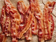 bacon strips sitting on top of a piece of paper