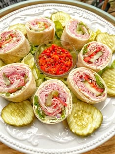 a white plate topped with lots of different types of food on top of each other