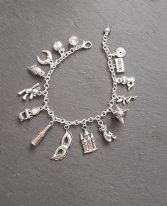 a silver bracelet with charms on it