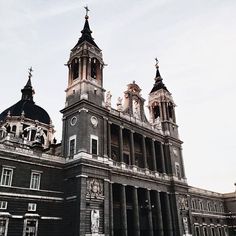 an old building with two large towers on top