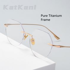 Upgrade your eyewear game with the KatKani Unisex Rimless Polygon Round Titanium Frame Eyeglasses. These sleek and stylish glasses are designed to elevate your look while providing optimal vision and comfort. Constructed using high-quality titanium, these frames are built to last. They offer durability and a lightweight feel, making them perfect for everyday wear. The rimless polygon round design adds a modern touch to your style, while the titanium material ensures a sturdy and comfortable fit. Glasses Without Frame, Rimless Glasses Women, Clear Glasses Frames Women, Unique Glasses Frames, Glasses For Round Faces, Cute Glasses Frames, Classy Glasses, Fancy Glasses, Clear Glasses Frames