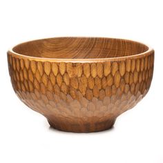 a wooden bowl is shown on a white background with an interesting design in the center