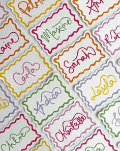 many different colored stickers with the word hello written on them in cursive writing