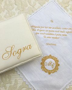 two wedding handkerchiefs with the words sognoa written in gold foil on them