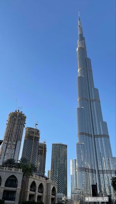 the tallest building in the world, burj dubai is seen from across the street