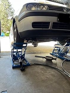 a car is being worked on in a garage