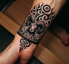 a person with a tattoo on their arm and wrist is holding onto a hand that has an intricate design