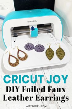 the cricut joy diy folded faux leather earrings is shown in front of an electric sewing machine