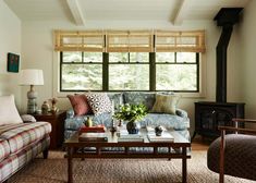 a living room filled with furniture and a fire place