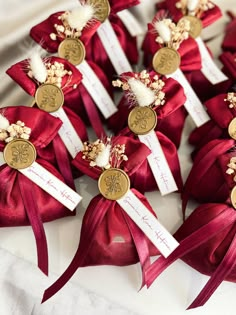 small red and gold wedding favors with ribbons