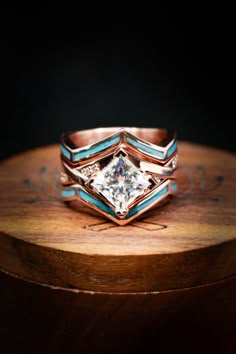 a close up of a ring on top of a wooden table