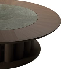 a round table with glass top and wooden base