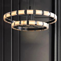 a modern chandelier hanging from the ceiling