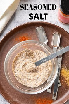 an image of seasoning salt in a glass bowl on a plate with spoons