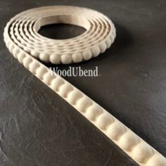 a pair of white rubber bands sitting on top of a black table next to each other