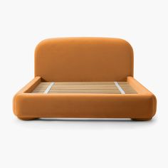 an orange bed with wooden slats on the headboard and foot board is shown in front of a white background